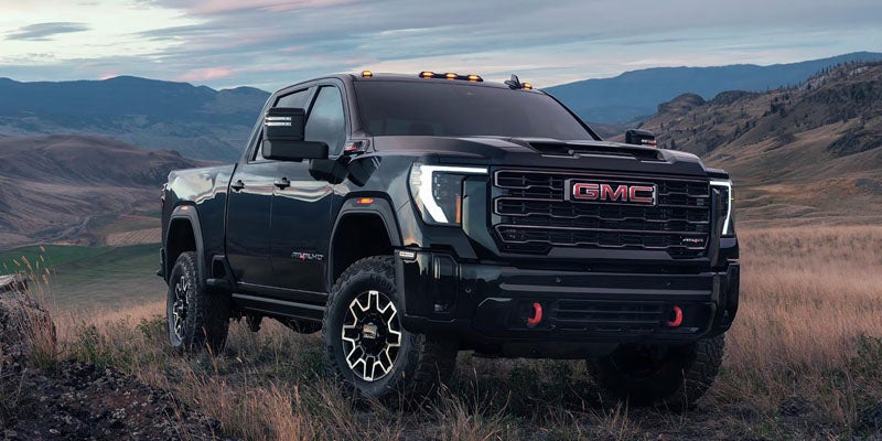 Black GMC heavy-duty pickup truck parked